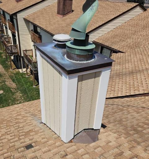 We inspected the prefabricated fireplace system and found it functional with no cleaning currently required. We identified disconnected dryer vent piping and missing ridge vent components requiring repair.