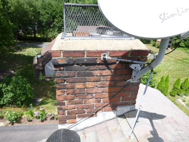 Partial chimney repair of chimney top – wirebrushed off the moss ,  replacing damaged brick, crowns, and flue tiles in Middletown CT.