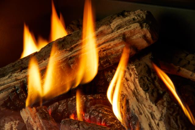 We removed the existing log set and prepared the fireplace for a new gas insert system. We installed a Regency GI-29 insert with liners and finished crown sealing.