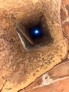 We installed a stainless steel liner to correct unsafe boiler venting and contain acidic exhaust moisture. We rebuilt damaged chimney sections and repaired the base to restore structural stability and protection.