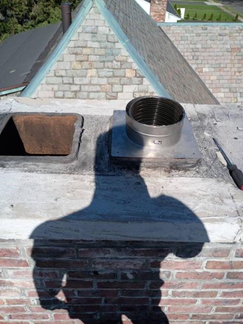 New Britain chimney inspection led to finding broken flue tile liner sections allowing hot flue gasses to escape.  Solution : Installation of a gas tight chimney liner system.