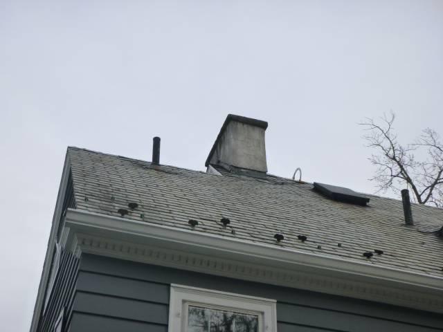 Hartford Ct Block chimney reconstruction with new flue tiles.