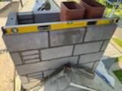 Hartford Ct Block chimney reconstruction with new flue tiles.