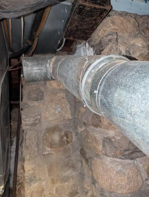 Acidic condensation from the boiler exhaust has damaged the chimney’s internal venting and surrounding structure. The new stainless steel liner and new smoke pipe will restore safe venting and protect the home.