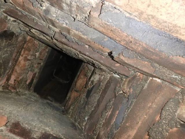 Unlined chimney flue in Tolland Ct - Installed a full liner system as well as a new Regency Woodstove Insert to upgrade their fireplace with secondary heating source.