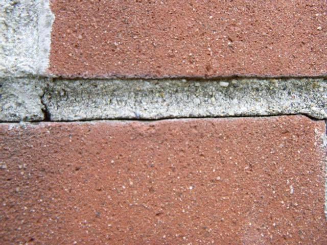 Condensation from an uninsulated liner and water intrusion were deteriorating the chimney’s masonry, crown, and shoulders. We’re insulating the liner, repairing masonry defects, rebuilding shoulders, and waterproofing the structure.