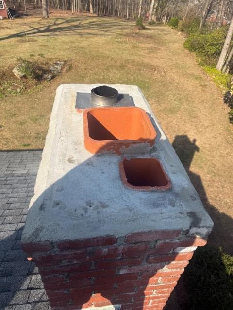 We removed cap, repaired crown with waterproof mortar, and reinstalled cap. We addressed acid damage and recommended annual liner maintenance.