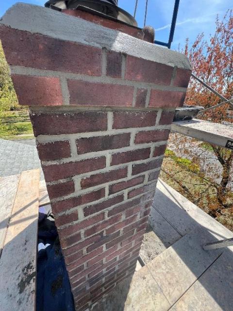 We repaired the chimney top, correcting structural damage and improper flashing to prevent water intrusion. We rebuilt crown and brickwork, restoring stability and proper function.