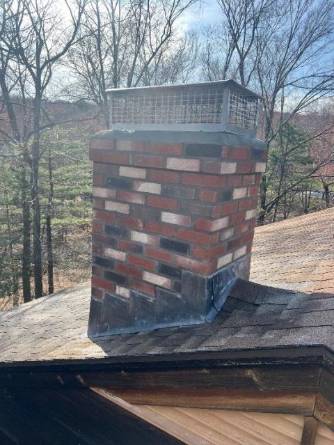 We rebuilt chimney top with new masonry, flashing, and crown. We also swept and removed creosote from older woodstove system , replacing the tile with a new stainless steel liner. This lowers the chances of creosote catching fire causing damage to the home as everything is contained in the liner sytems.