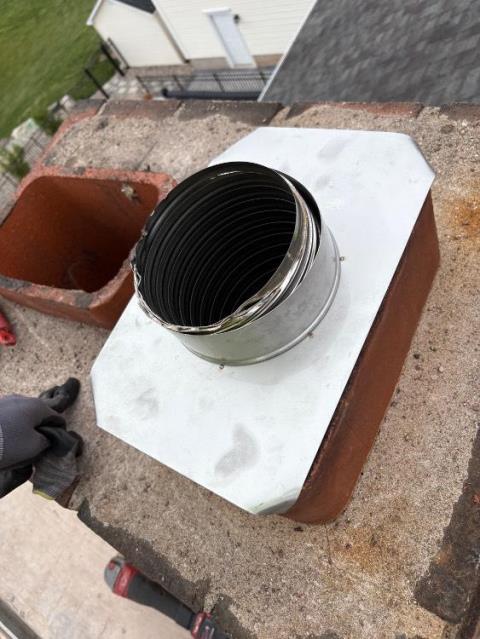In Wallingford, CT We installed a stainless steel two-ply smooth wall liner to restore proper venting and bring the oil boiler back to code. We reconstructed the cement crown and repointed the damaged masonry to stop water and acidic moisture from causing further deterioration.
