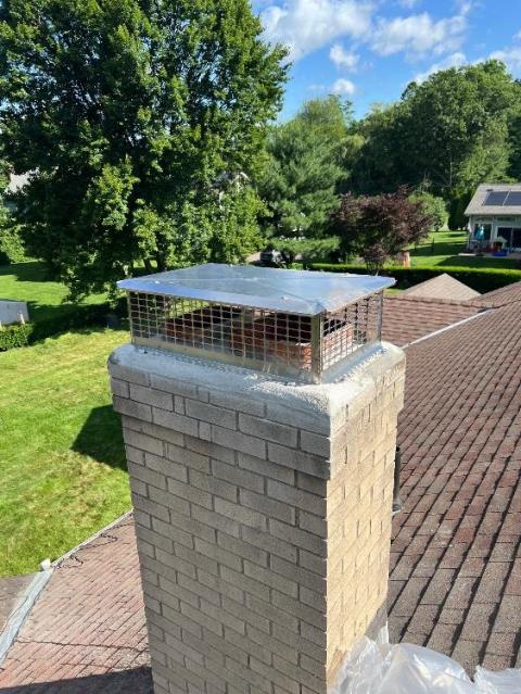 In South Windsor, CT, Level 1 Inspection Found The Top Cement Crown Is Fractured and Lifted Off Of the Brickwork. Need To Demo And Remove The Entire Top Cement Crown and Reconstruct A New Cement Crown With Proper Drip Edge To Properly Shed Water Thus Keeping the Lower Masonry Structure Protected.