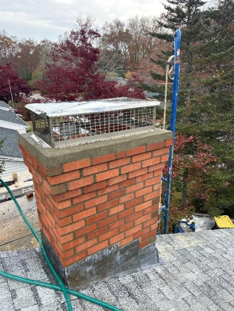 In Windham, CT, We installed an insulated stainless steel liner to safely vent exhaust and prevent further chimney deterioration. The chimney was then fully rebuilt with new brick, flue tiles, crown, flashing, and cap.
