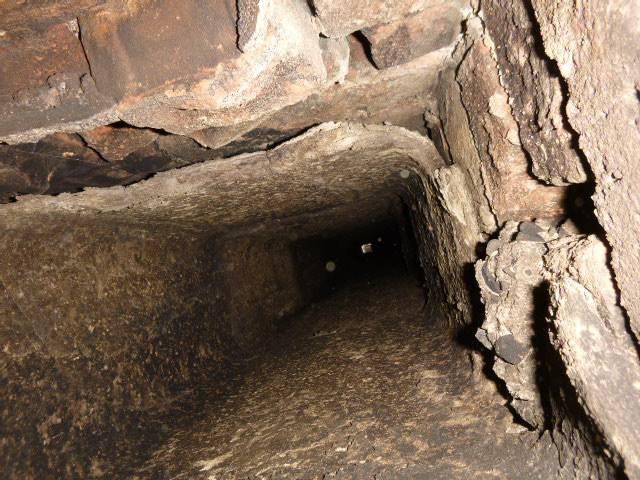 During a chimney inspection in Glastonbury ct , we found that the flue tile liner system was falling apart.  Installed a new stainless steel system and connected it to the heating system with a stainless steel tee 