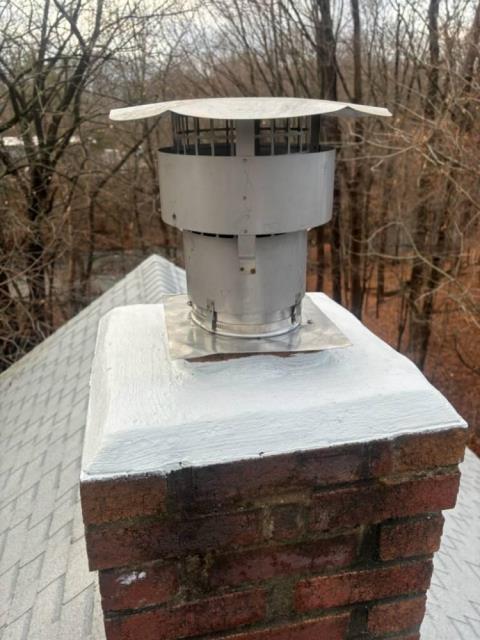 Manchester ct chimney crown had some minor water damage. The furnace flue did not have a rain cap , allowing years of water to enter flue tile system accelerating damage.  Installed a new chimney liner system with a rain cap  , and performed a crownseal to protect the top.