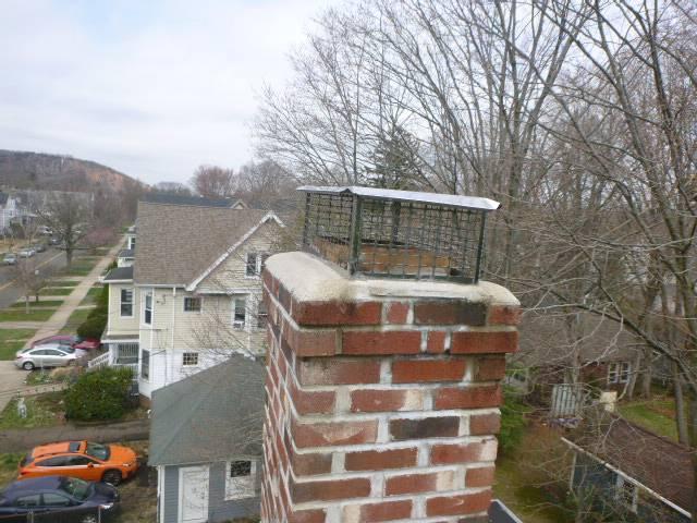 We replaced damaged flashing with properly installed coil stock to prevent water intrusion. We rebuilt the crown to improve drainage and protect the chimney structure. Reinstalled customers chimney cap.