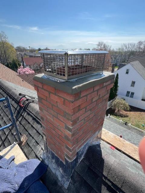 We rebuilt the chimney to the roofline with new brick, crown, flashing, flue tiles, and protective caps. We corrected structural damage and restored safe venting for the fireplace, hot water, and heating systems.