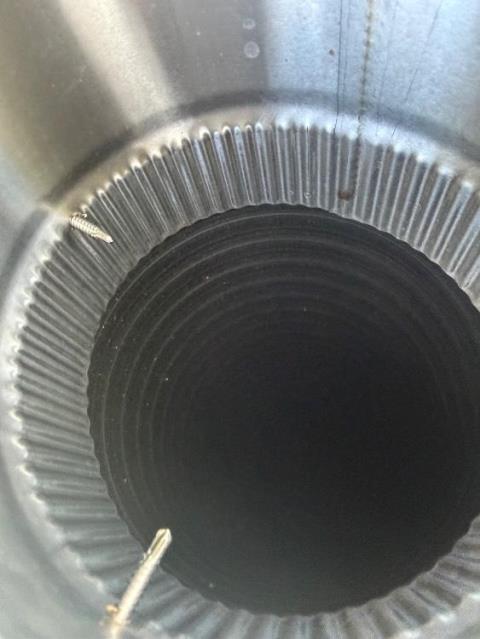 We installed a stainless liner to correct venting and contain acidic exhaust. We replaced connector pipes and cleaned the system to protect remaining masonry.