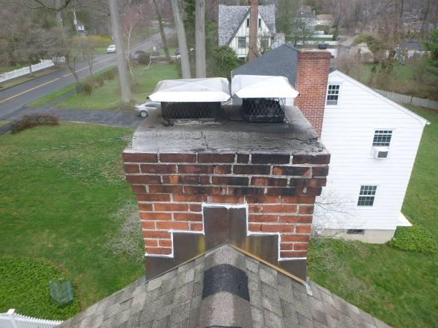 We repaired deteriorated flue voids and restored safe venting throughout the fireplace system. We removed glazed creosote and repaired exterior masonry deterioration via a repointing and a crown seal.