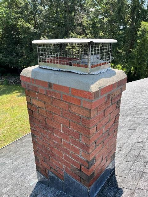 In Windsor, CT, Level 1 Inspection Found The Top of the Chimney Has Saturation and Structural Damages Developing. Rebuilt the top corbeled edge and crown.  Reinstalled customers existing cap.