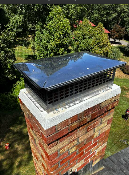 In Vernon, CT, we rebuilt the chimney's shoulder shelf with new bluestone and applied crown coat to seal existing hairline cracks. Treated exterior with water repellent to prevent further weather-related damage.