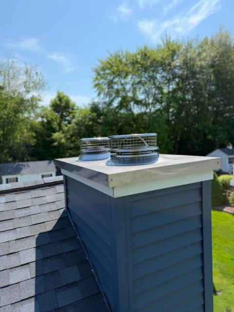 We replaced the chase pan, storm collars, and chimney caps with custom stainless steel components in Enfield CT.  We corrected water entry issues and ensured proper drainage protection.