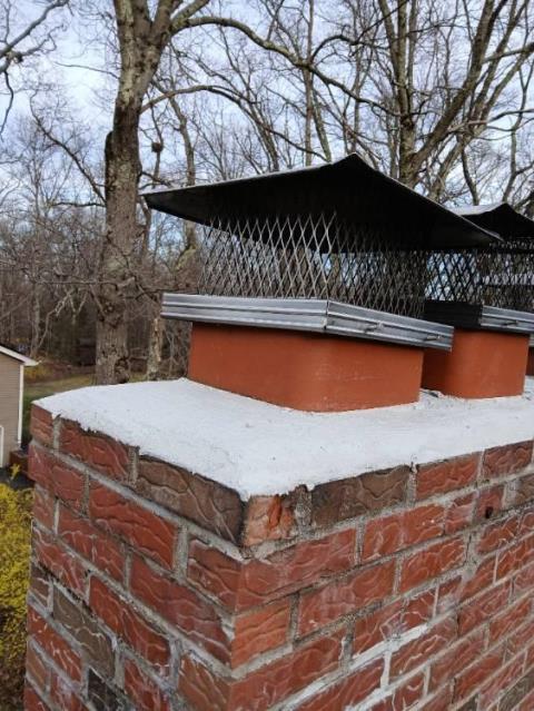 We installed a properly sized stainless steel liner to correct venting and condensation issues. We repaired the crown with waterproof mortar to prevent water intrusion.