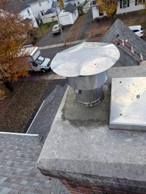 In East Hartford CT, We removed the damaged single-ply liner and installed a properly sized stainless steel two-ply smoothwall liner system. This new installation restored safe venting, protected the chimney structure, and ensured proper exhaust of combustion by-products.