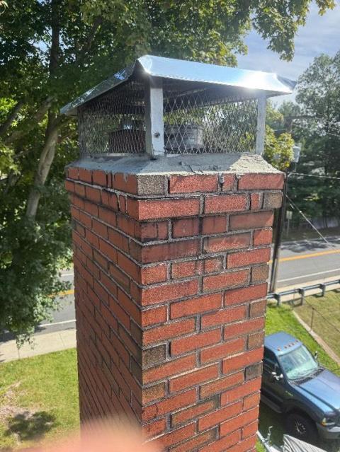 In manchester, CT, We replaced the cracked chimney crown and rebuilt the damaged shoulder to stop further water intrusion. Firebrick inside the woodstove insert was also replaced.