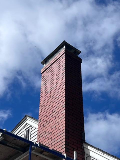 In manchester, CT, We replaced the cracked chimney crown and rebuilt the damaged shoulder to stop further water intrusion. Firebrick inside the woodstove insert was also replaced.