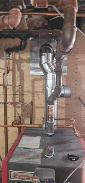 In Windsor CT, Homeowner Has a High Efficient Beckett AFG Oil Burner Tied Into the Original Oversized Tall Cold Exterior Chimney Structure, the exhaust of which is mixing with condensation and causing sulphuric acid damage to the flue. Recommend a stainless steel 2-ply chimney liner to provide safety and longevity of the venting system.