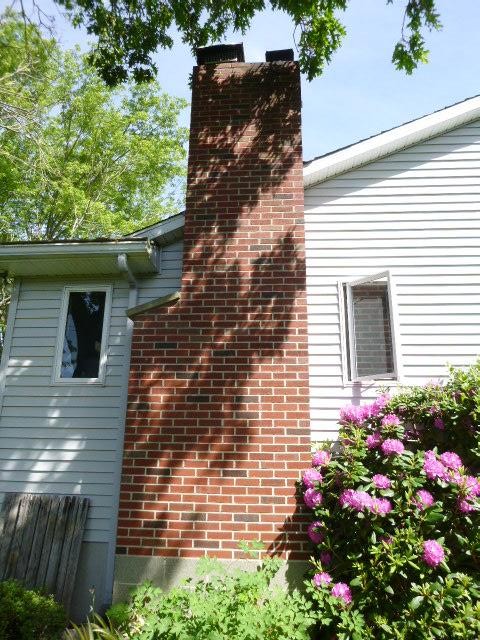 In Norwich CT, The Entire Top Of The Chimney And Neighboring Fireplace Had Sulfuric Acid and Structural Damages Developing Down to the Roofline. We did a roof up rebuild with New Brick and Cement, New Flashing Properly Tucked 2 Inches Deep and Cemented In Place, Replaced All Top Fireplace Flue Tiles And Properly Cemented Together.
