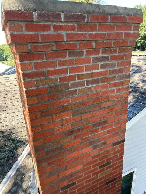 In Norwich CT, The Entire Top Of The Chimney And Neighboring Fireplace Had Sulfuric Acid and Structural Damages Developing Down to the Roofline. We did a roof up rebuild with New Brick and Cement, New Flashing Properly Tucked 2 Inches Deep and Cemented In Place, Replaced All Top Fireplace Flue Tiles And Properly Cemented Together.