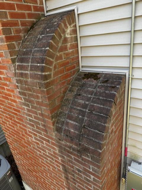 In Manchester, CT, doing a roof-up chimney rebuild due to extensive water damage and freeze/thaw deterioration. New brick, mortar, lead flashing, a cement crown, and a stainless steel multi-flue cap.