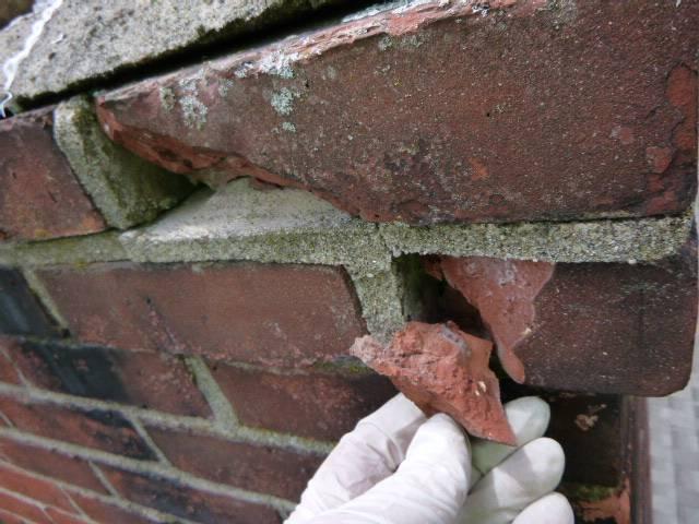Acidic flue condensation rotted the chimney top, leaving damaged flue tiles, loose masonry, and water-entry points. We're rebuilding the top courses, replacing flue tiles, crown, and installing a protective stainless-steel cap.
