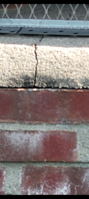Acidic condensation deteriorated this oversized chimney's flue. We're installing a properly sized stainless steel liner and waterproofing the crown to restore safe venting and prevent further damage.