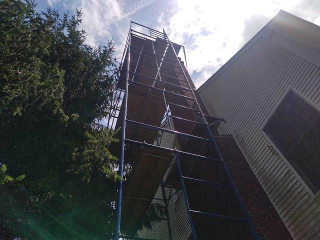 Acidic condensation deteriorated this oversized chimney's flue. We're installing a properly sized stainless steel liner and waterproofing the crown to restore safe venting and prevent further damage.