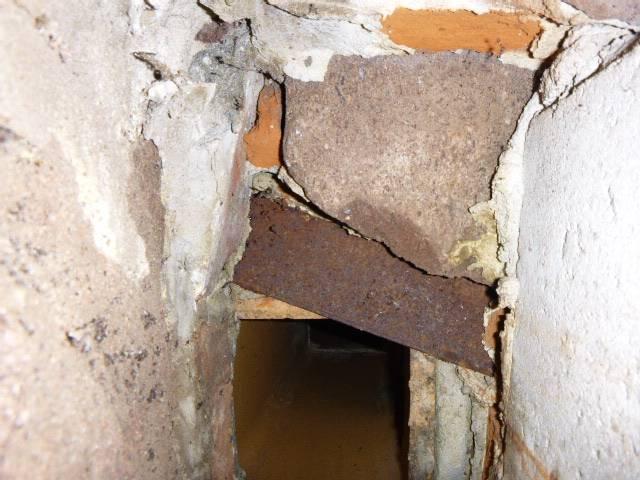 We removed an unsafe galvanized venting system causing draft failure and installed a continuous stainless steel chimney liner to restore safe, efficient venting for both gas appliances.