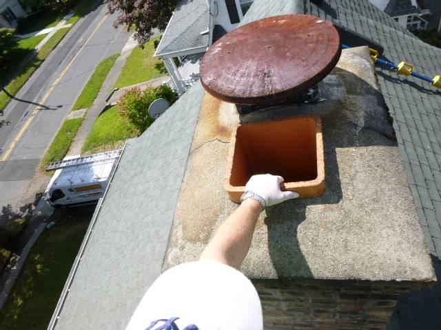 In Bristol CT We installed a stainless steel liner for the oil boiler and replaced rusted non stainless steel cap.  This corrected acidic condensation and protected the chimney and home.