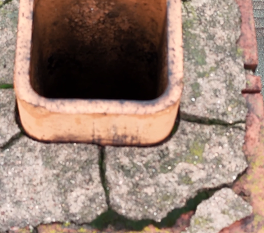 We’re correcting acid-damaged chimney venting by installing a properly sized stainless steel liner, rebuilding the crown, repointing mortar, sealing flashing, and adding a cap for lasting protection.