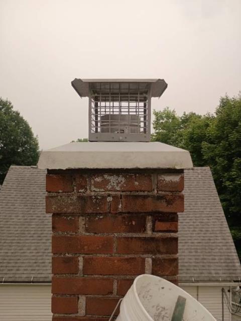 We’re correcting acid-damaged chimney venting by installing a properly sized stainless steel liner, rebuilding the crown, repointing mortar, sealing flashing, and adding a cap for lasting protection.