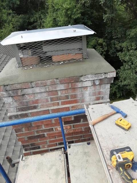 We’re removing collapsed, acid-damaged flue tiles, installing a properly sized stainless steel liner in Glastonbury, ct  and rebuilding the deteriorated chimney crown to restore safe, efficient venting and protect the masonry.