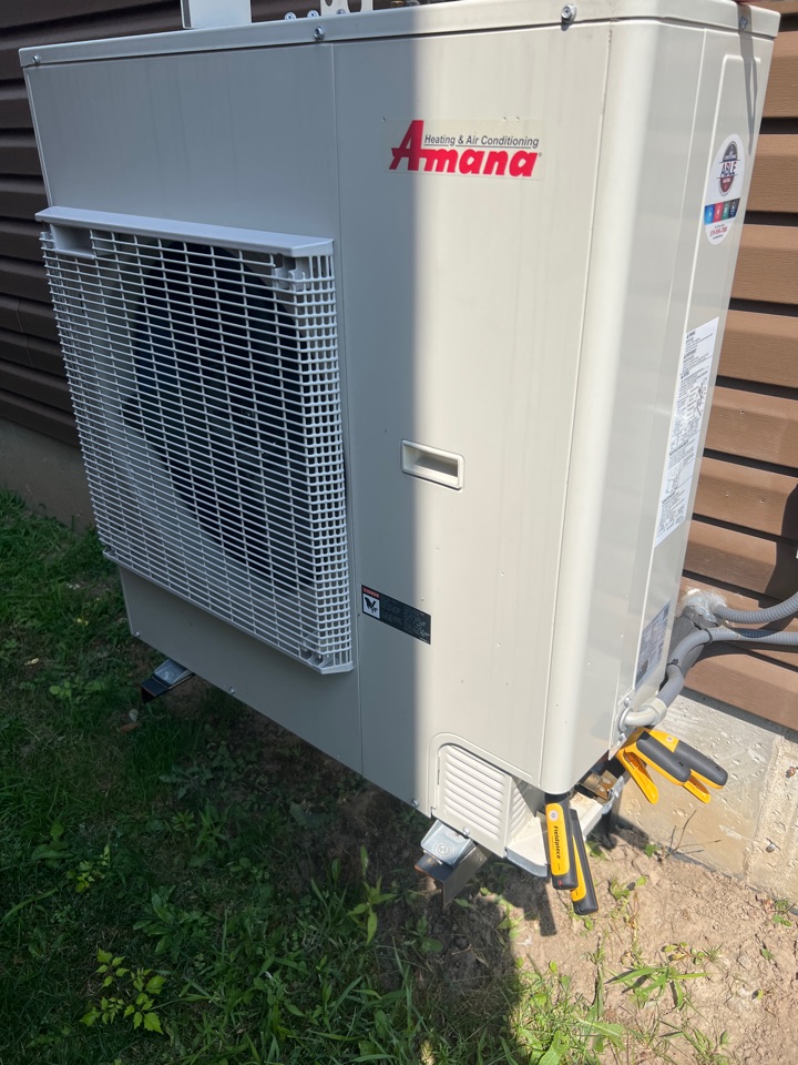 Servicing a heat pump for a family in Kitchener Ontario Servicing a heat pump for a family in Kitchener Ontario