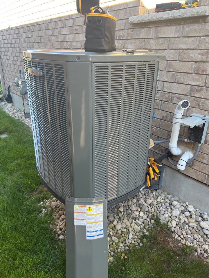 Servicing an AC unit for a family in New Hamburg Ontario Servicing an AC unit for a family in New Hamburg Ontario