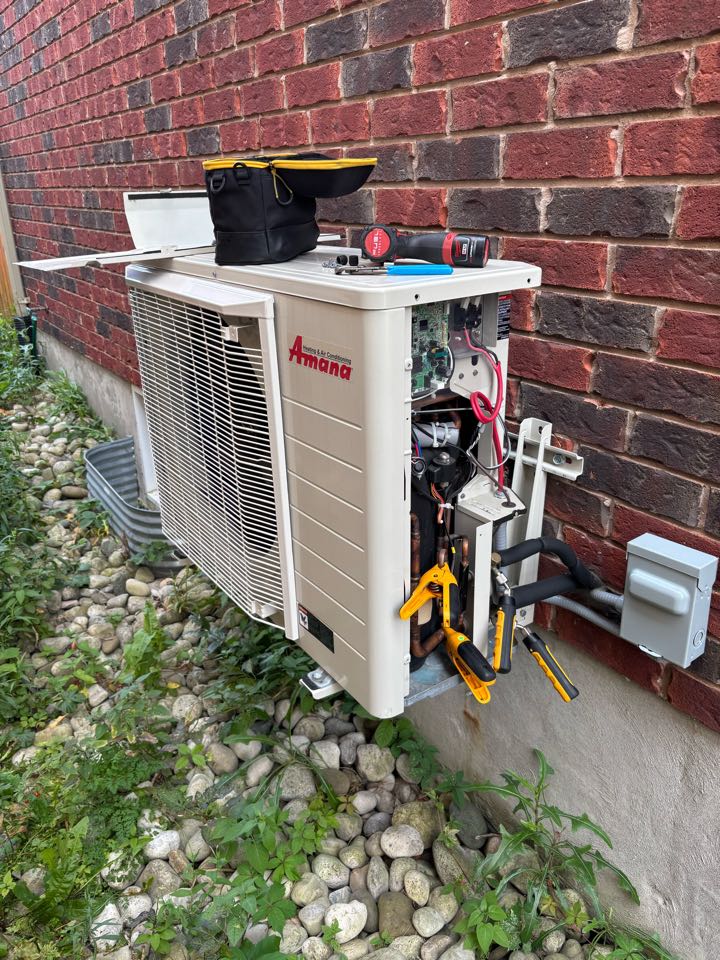 Completing an Amana Heat pump tune up for a family in the Highland West area of Kitchener