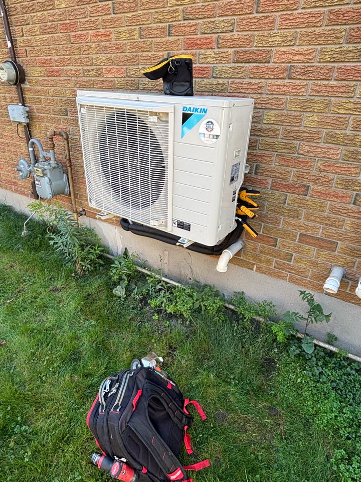 Completing a Daikin Heat pump tune up for a family in New Hamburg