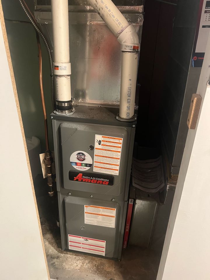 Servicing an Amana furnace for a family in the Southdale area of  Kitchener 