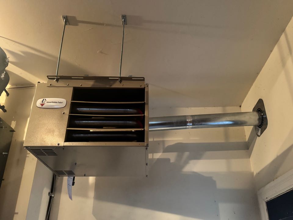 Completing an ADP Garage heater install for a family in New Hamburg area