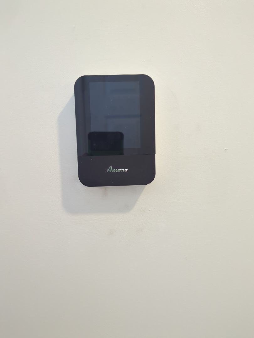 Completing an Amana thermostat service for a family in the Brant area of Guelph