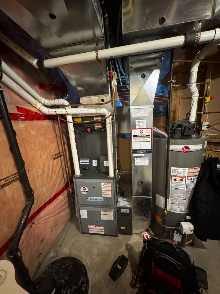 Servicing a Daikin furnace for a family in the Farnham area of Guelph 