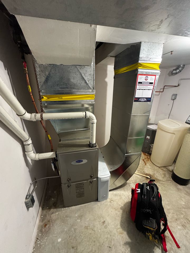 Servicing a Carrier furnace for a business in the Alpine Village area of Kitchener 
